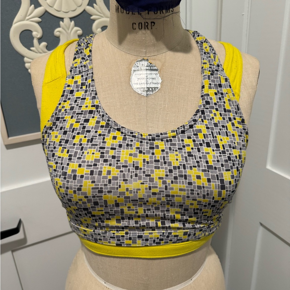 Two vintage Moving Comfort sports bras.